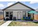 Charming home exterior with inviting porch, modern lighting, and well-manicured lawn at 4080 Adams St, Denver, CO 80216