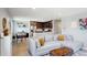Open-concept living space featuring a stylish sofa, dining area and well-equipped kitchen at 4080 Adams St, Denver, CO 80216