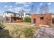 Expansive backyard showcasing the home's outdoor space and detached brick structure at 474 S Gaylord St, Denver, CO 80209
