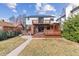 The beautiful backyard features a spacious lawn, wooden deck, and a charming pergola at 474 S Gaylord St, Denver, CO 80209