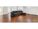 Finished basement with laminate wood floors and a plush seating area at 474 S Gaylord St, Denver, CO 80209