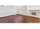 This basement room features laminate wood flooring, baseboard heating and a fireplace at 474 S Gaylord St, Denver, CO 80209
