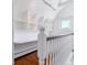 This upstairs hallway features bright white walls, wood floors and built in shelving and work area at 474 S Gaylord St, Denver, CO 80209