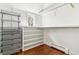This organized walk-in closet has hanging racks, drawers and shelves for optimal storage space at 474 S Gaylord St, Denver, CO 80209