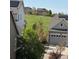 Scenic backyard view showcasing lush greenery, neighboring homes, and a serene community atmosphere at 8163 S Valleyhead Way, Aurora, CO 80016