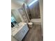 Bathroom features a vanity with solid surface top, framed mirror and tiled shower over tub at 8163 S Valleyhead Way, Aurora, CO 80016