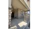 Inviting covered front porch with stone pillars and stone veneer, creating an attractive entrance to the home at 8163 S Valleyhead Way, Aurora, CO 80016