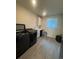 A functional laundry room includes modern washer, dryer, utility sink and lots of storage at 8163 S Valleyhead Way, Aurora, CO 80016