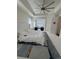 Spacious main bedroom boasts a tray ceiling with fan and a cozy seating nook with comfortable lounge chairs at 8163 S Valleyhead Way, Aurora, CO 80016