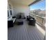 Inviting covered patio with comfortable seating and a stainless steel grill, perfect for outdoor entertaining at 8163 S Valleyhead Way, Aurora, CO 80016
