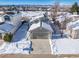 Attractive home exterior with snowy landscape at 9485 Joyce Ln, Highlands Ranch, CO 80126