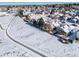 Aerial view of house and neighborhood in winter at 9485 Joyce Ln, Highlands Ranch, CO 80126