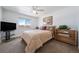 Spacious bedroom with a ceiling fan and a large window at 9485 Joyce Ln, Highlands Ranch, CO 80126