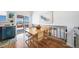 Light-filled dining area with wood floors and access to a deck at 9485 Joyce Ln, Highlands Ranch, CO 80126