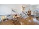 Bright dining area with hardwood floors and a view to the living room at 9485 Joyce Ln, Highlands Ranch, CO 80126