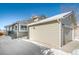 House exterior showcasing garage and snowy yard at 9485 Joyce Ln, Highlands Ranch, CO 80126