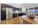 Modern kitchen with stainless steel appliances and wood flooring at 9485 Joyce Ln, Highlands Ranch, CO 80126