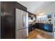 Modern kitchen with dark cabinets and stainless steel appliances at 9485 Joyce Ln, Highlands Ranch, CO 80126