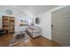 Living room features hardwood floors, large window, and a couch at 9485 Joyce Ln, Highlands Ranch, CO 80126