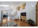 Living room with hardwood floors and stairs to upper level at 9485 Joyce Ln, Highlands Ranch, CO 80126