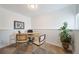 Home office with a desk, chairs, and built-in shelves at 9485 Joyce Ln, Highlands Ranch, CO 80126