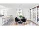 Bright dining area with a round table and black velvet chairs at 1365 Gentry Pl, Castle Rock, CO 80104