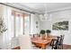 Elegant dining room with hardwood floors and large windows at 1365 Gentry Pl, Castle Rock, CO 80104