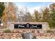 Stone sign for Plum Creek Golf Club at 1365 Gentry Pl, Castle Rock, CO 80104