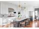 Modern kitchen with large island and stainless steel appliances at 1365 Gentry Pl, Castle Rock, CO 80104