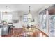 Kitchen features breakfast nook, island, and hardwood floors at 1365 Gentry Pl, Castle Rock, CO 80104