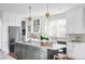 Modern kitchen with large island and stainless steel appliances at 1365 Gentry Pl, Castle Rock, CO 80104