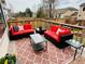 Relax on this outdoor back deck with modern furniture and colorful decor that creates a comfortable outdoor living space at 15498 E Dorado Pl, Centennial, CO 80015
