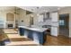 Bright, open kitchen featuring a center island, stainless steel appliances, and hardwood floors at 15498 E Dorado Pl, Centennial, CO 80015