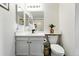 Neat bathroom with modern vanity and fixtures, along with ample lighting, providing a comfortable space at 8422 Everett Way # C, Arvada, CO 80005