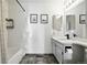 Clean bathroom featuring a shower-tub combo, updated vanity, and classic fixtures, offering a functional space at 8422 Everett Way # C, Arvada, CO 80005