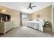 A spacious bedroom with a ceiling fan and a bright window, enhancing the relaxing atmosphere at 8422 Everett Way # C, Arvada, CO 80005