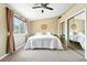 A serene bedroom with large windows, a ceiling fan and ample closet space, creating a comfortable retreat at 8422 Everett Way # C, Arvada, CO 80005