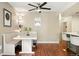 Bright dining area featuring a modern table, bench seating, and stylish lighting at 8422 Everett Way # C, Arvada, CO 80005