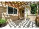 Charming front porch features a pergola, creating a welcoming entry to this lovely home at 8422 Everett Way # C, Arvada, CO 80005
