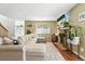 Comfortable living room with a stone fireplace, and a large sectional sofa at 8422 Everett Way # C, Arvada, CO 80005