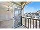 Balcony with sliding glass door offering an indoor-outdoor flow and community views at 31112 Black Eagle Dr # 103, Evergreen, CO 80439