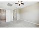 Bright, neutral bedroom featuring a ceiling fan and multiple access points at 31112 Black Eagle Dr # 103, Evergreen, CO 80439