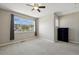 Bedroom with a large window dressed with curtains and a dark dresser at 31112 Black Eagle Dr # 103, Evergreen, CO 80439