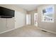 Bedroom with a sliding closet door, a window, and a door to the bathroom at 31112 Black Eagle Dr # 103, Evergreen, CO 80439