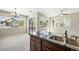 Kitchen sink with granite countertops and cabinets, in an open floor plan with lots of natural light at 31112 Black Eagle Dr # 103, Evergreen, CO 80439