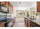 Beautiful kitchen featuring granite countertops, stainless steel appliances, and an open layout at 31112 Black Eagle Dr # 103, Evergreen, CO 80439