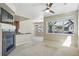 Open living room with large windows and fireplace offers ample natural light and great views at 31112 Black Eagle Dr # 103, Evergreen, CO 80439