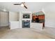 Inviting living area with a cozy fireplace next to a modern kitchen with dark wood cabinets at 31112 Black Eagle Dr # 103, Evergreen, CO 80439