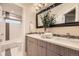 Bathroom boasting double vanity, modern fixtures, and decorative mirror at 2442 S Bannock St, Denver, CO 80223