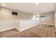 Bonus room offering ample space with mounted TV and natural light from door and window at 2442 S Bannock St, Denver, CO 80223